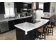 View of the updated kitchen with center island and modern appliances, creating an inviting cooking space at 13219 W Aleppo Dr, Sun City West, AZ 85375