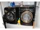 Laundry room features modern black washer and dryer units at 13219 W Aleppo Dr, Sun City West, AZ 85375