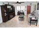 Cozy living room features tile floors, entertainment center, ceiling fan, and natural light at 13219 W Aleppo Dr, Sun City West, AZ 85375