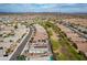 Sweeping aerial perspective of a home with a pool and solar panels in a vibrant community at 13529 W Remuda Dr, Peoria, AZ 85383