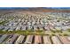 Aerial view of a residential area showcasing desert landscaping and single-story homes, many equipped with solar panels at 13529 W Remuda Dr, Peoria, AZ 85383