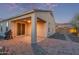 Covered back patio with BBQ, pavers and adjacent desert landscaping, perfect for outdoor entertaining at 13529 W Remuda Dr, Peoria, AZ 85383