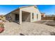 A spacious covered backyard patio overlooking the landscaped yard at 13529 W Remuda Dr, Peoria, AZ 85383