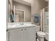 Bathroom featuring a single sink vanity, tiled shower-tub combo, and neutral wall color at 13529 W Remuda Dr, Peoria, AZ 85383