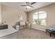 Bedroom showcasing a large window, neutral walls, carpeted floor, and stylish furnishings at 13529 W Remuda Dr, Peoria, AZ 85383