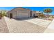 A house with desert landscaping, a wide driveway, and an attached two-car garage at 13529 W Remuda Dr, Peoria, AZ 85383