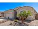 Charming home showcasing desert landscaping, a barrel tile roof, and a two-car garage at 13529 W Remuda Dr, Peoria, AZ 85383