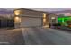 Home exterior featuring a large two car garage and paved driveway at 13529 W Remuda Dr, Peoria, AZ 85383