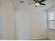 Minimalist bedroom design featuring a lighted ceiling fan and bright blinds at 14132 W Valentine St, Surprise, AZ 85379