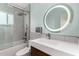 Modern bathroom features a sleek vanity, contemporary fixtures, and a shower-tub combo at 1435 W 6Th St, Mesa, AZ 85201