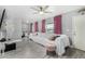 Open living room featuring light gray walls, a ceiling fan, and neutral-toned furniture at 1435 W 6Th St, Mesa, AZ 85201