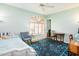 Bright bedroom with a ceiling fan, large windows with shutters, and a work desk at 1538 E Peach Tree Dr, Chandler, AZ 85249