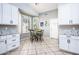 Bright breakfast nook with white cabinets, modern lighting and sunny window views at 1538 E Peach Tree Dr, Chandler, AZ 85249