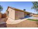 The back of the home features an enclosed patio and a low maintenance gravel yard at 1538 E Peach Tree Dr, Chandler, AZ 85249