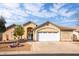 Charming single-story home with a two-car garage and well-maintained front yard landscape at 1538 E Peach Tree Dr, Chandler, AZ 85249