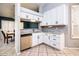 Beautiful kitchen with white cabinets, updated backsplash and stainless steel appliances at 1538 E Peach Tree Dr, Chandler, AZ 85249
