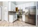 Well-appointed kitchen featuring stainless steel appliances and bright white cabinetry at 1538 E Peach Tree Dr, Chandler, AZ 85249
