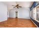 Bright living room with vaulted ceilings, a ceiling fan, and wood-look floors at 1538 E Peach Tree Dr, Chandler, AZ 85249
