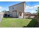 Spacious backyard featuring a lush lawn, covered patio, and ample space for outdoor entertaining at 15646 N 20Th Ave, Phoenix, AZ 85023