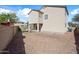 Expansive backyard showing the exterior of the home and surrounding fence for added privacy at 15646 N 20Th Ave, Phoenix, AZ 85023