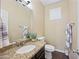 Bathroom with a granite countertop, undermount sink, neutral walls, and white accents at 15646 N 20Th Ave, Phoenix, AZ 85023