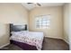 Comfortable bedroom with a ceiling fan, a large window with shutters, and plush carpeting at 15646 N 20Th Ave, Phoenix, AZ 85023