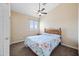 Inviting bedroom with a ceiling fan, large window, and comfortable bed at 15646 N 20Th Ave, Phoenix, AZ 85023