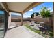 Relaxing covered patio featuring a seating area with an adjacent xeriscaped backyard at 15646 N 20Th Ave, Phoenix, AZ 85023