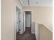 Hallway on the upper level with multiple doors and access to rooms and storage at 15646 N 20Th Ave, Phoenix, AZ 85023