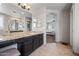 Bathroom featuring a granite countertop vanity and access to the main bedroom at 15646 N 20Th Ave, Phoenix, AZ 85023