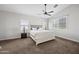 Serene main bedroom with a plush bed, neutral tones, and natural light from shuttered windows at 15646 N 20Th Ave, Phoenix, AZ 85023