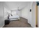 Bright main bedroom with plush carpet, shuttered windows, and a contemporary ceiling fan at 15646 N 20Th Ave, Phoenix, AZ 85023