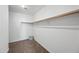 Walk-in closet with carpet flooring and a hanging rod ready for organization at 15646 N 20Th Ave, Phoenix, AZ 85023