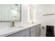 Bathroom featuring double vanity, quartz counters and modern fixtures at 1610 W Dunlap Ave, Phoenix, AZ 85021