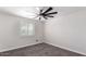 Bright bedroom featuring a modern ceiling fan and plantation shutters at 1610 W Dunlap Ave, Phoenix, AZ 85021