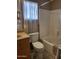 Bathroom showcasing a vanity, toilet, and a shower-tub combination at 17200 W Bell Rd # 2301, Surprise, AZ 85374