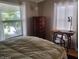 Bedroom featuring a comfortable bed and a window view at 17200 W Bell Rd # 2301, Surprise, AZ 85374