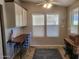 Cozy breakfast nook featuring tile flooring, a small desk, and natural light from two windows at 17200 W Bell Rd # 2301, Surprise, AZ 85374