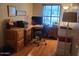 Functional home office with a desk, rolling chair, and file storage at 17200 W Bell Rd # 2301, Surprise, AZ 85374