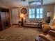 Cozy living room with a plush sofa, two chairs, and natural light at 17200 W Bell Rd # 2301, Surprise, AZ 85374