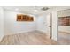 A spacious bedroom with wood-look floors, white trim, a ceiling fan, and wood shutter window coverings at 1801 E Berridge Ln, Phoenix, AZ 85016