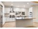 Bright and airy kitchen with a large island, modern appliances, and stylish tile backsplash at 1801 E Berridge Ln, Phoenix, AZ 85016