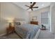 Comfortable bedroom featuring a queen bed and neutral walls at 18601 W Thunderhill Pl, Goodyear, AZ 85338