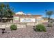 Stone community sign at Presidio Residents Club with manicured landscaping and clear signage at 18601 W Thunderhill Pl, Goodyear, AZ 85338