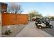 Golf Club entrance with golf carts parked and signage, beautiful desert landscaping at 18601 W Thunderhill Pl, Goodyear, AZ 85338