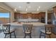 Beautiful kitchen island with stainless steel sink and seating for three at 18601 W Thunderhill Pl, Goodyear, AZ 85338