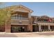 A ground-level view of the community retail area including a Safeway and a Signature Cafe at 18601 W Thunderhill Pl, Goodyear, AZ 85338