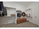 Walk-in closet with custom shelving and a wooden chest, providing organized storage solutions at 18601 W Thunderhill Pl, Goodyear, AZ 85338