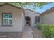 Charming home with a well-maintained walkway and lush desert landscaping at 19602 N Canyon Whisper Dr, Surprise, AZ 85387