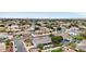 Expansive aerial view of a residential neighborhood featuring tree-lined streets and well-maintained homes at 2102 E Norwood St, Mesa, AZ 85213